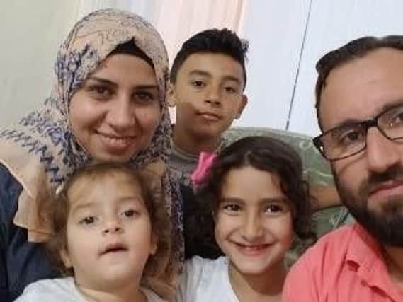 Ahmad Alabboud and Malak Albetre with their children, Noor, four, Dana, seven, and Meral, two