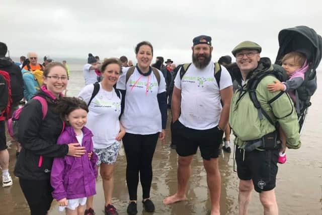 Participants take part in the Morecambe Bay Walk in aid of Derian House, in Chorley