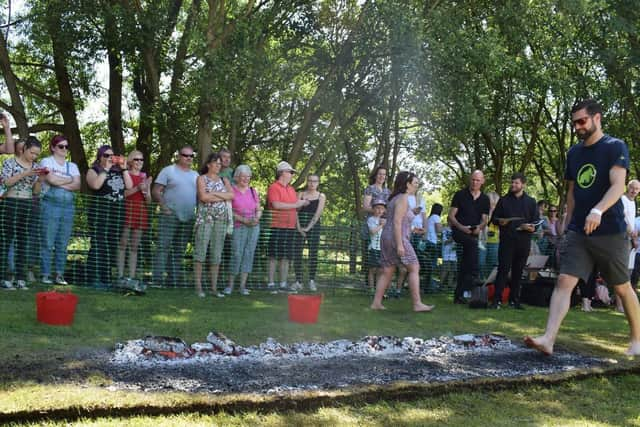 Leon Stott, of Farington, walking across hot coals for St Catherine's Hospice