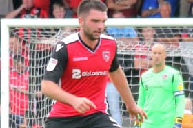 Alex Kenyon made three late saves as Morecambe's emergency keeper
