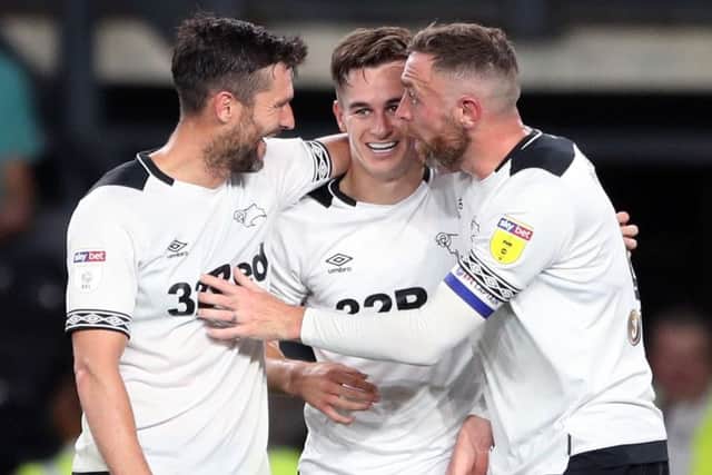 Tom Lawrence (centre) celebrates scoring Derby's second goal against Ipswich on Tuesday night