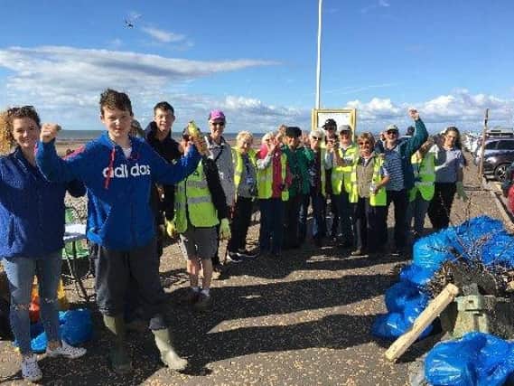 Volunteers from the Rossall Beach Residents and Community Group tackling the rubbish on Rossall Beach. (s)
