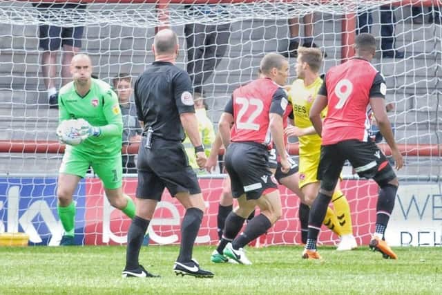 Barry Roche will be suspended for Morecambe's match with Oldham Athletic tomorrow following his midweek red card