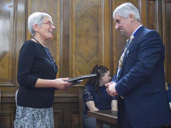 Preston mayor, councillor Trevor Hart presented Lynn Rankin with a book of condolence to honour the late Peter Rankin