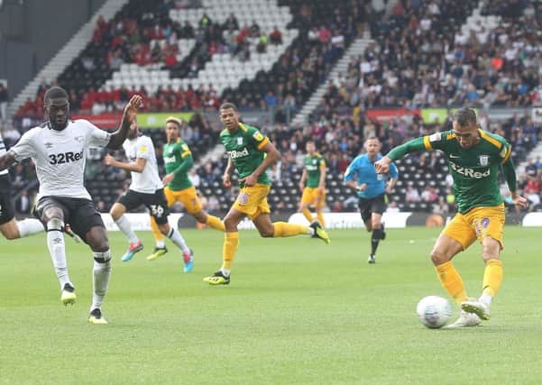 Graham Burke sends over a cross on another frustrating day for Preston North End's frontline at Pride Park on Saturday