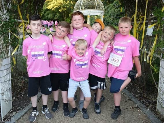 Jack Moody, second left, with his friends at the Moonlight and Memories Walk for St Catherine's Hospice