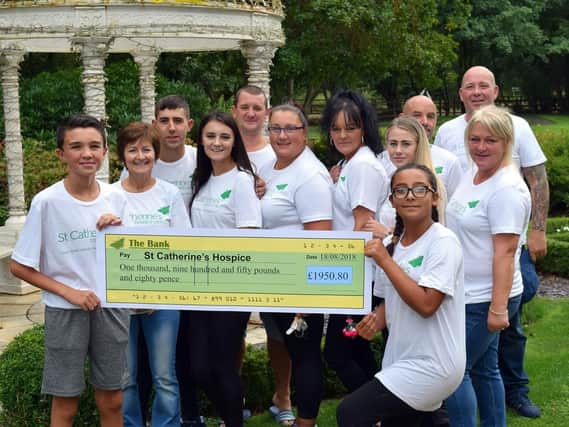 A group of family and friends raised almost 2,000 for St Catherines Hospice in memory of Debbie Price