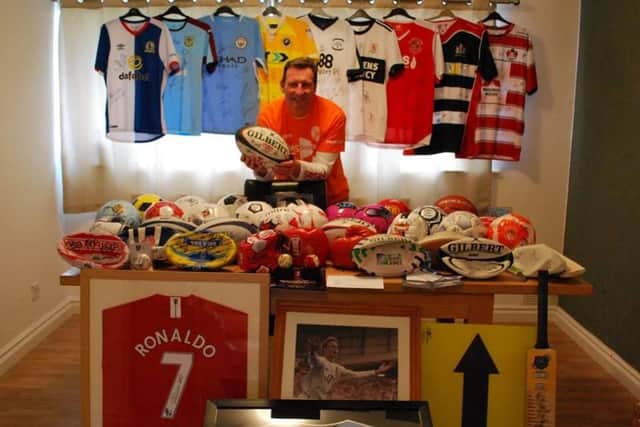 Kevin Shurmer, of Croston, who has MS, with some of the sporting items to auction off through his Balls to MS campaign
