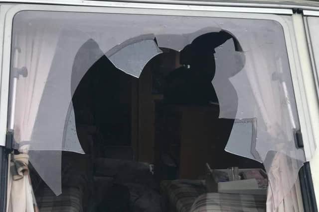A smashed caravan window at T B & B Anderton in Westhoughton Road, Adlington