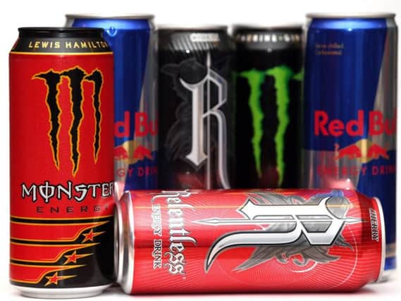 Cans of Red Bull, Monster and Relentless energy drinks. Children in England are to be banned from buying energy drinks under Government plans