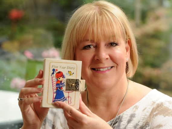 Michelle McCue's father found a diary from the 1980s in a suspended ceiling at her house