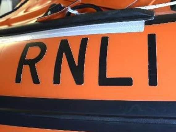 Drunk teenagers threatened lifeboat volunteers with violence after they were called to help the youngsters in the sea.