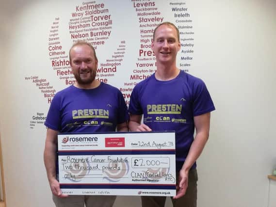 Michael Brennand (left), director of this years annual City of Preston Road Race, presents Rosemere Cancer Foundations head of fundraising Dan Hill with a cheque for 2,000.