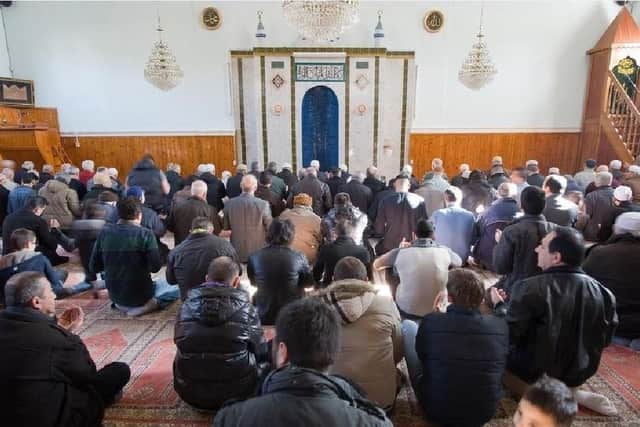 People praying in a Mosque