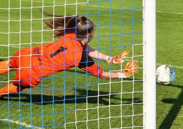 Rachel Darbyshire saves in the shoot-out