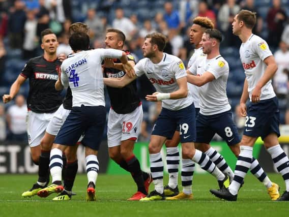 Ben Pearson and Joe Williams clash at the end of Preston's 2-2 draw with Bolton
