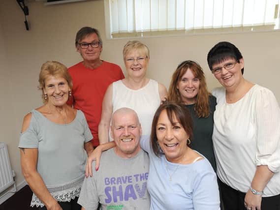 Frank Hogarth gets his head shaved for charity at the Royal British Legion in Lostock Hall. He is pictured with family and friends