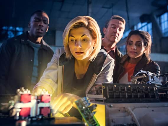 Jodie Whittaker as The Doctor (centre), Bradley Walsh as Graham (second right) and Mandip Gill as Yaz (first right)
