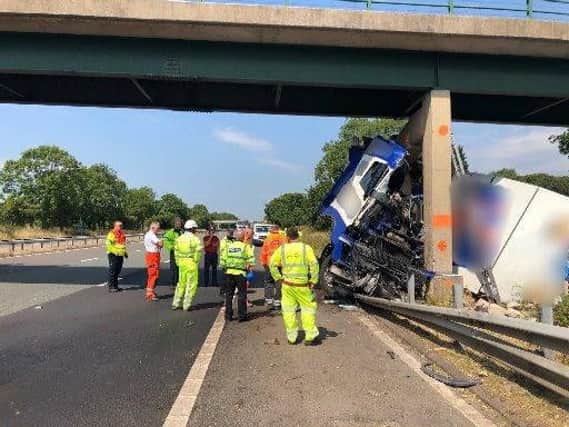 The scene on the M6 after a lorry crashed into a bridge in July - preventing hospital staff from getting to work.