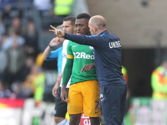Darnell Fisher receives instructions from Alex Neil