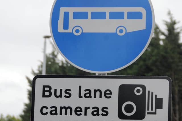 Some of the signs placed to warn motorists of the new bus lane