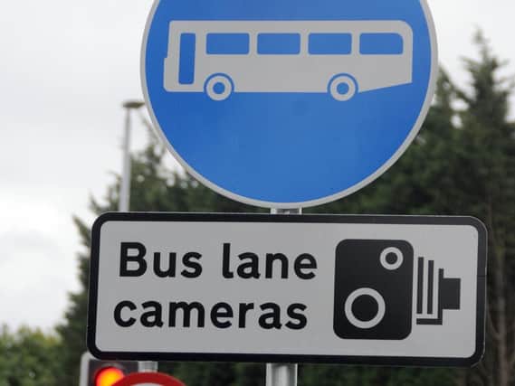 Some of the signs placed to warn motorists of the new bus lane