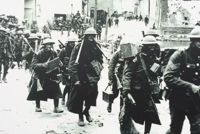 British soldiers marching through Bouzincourt during the First World War.