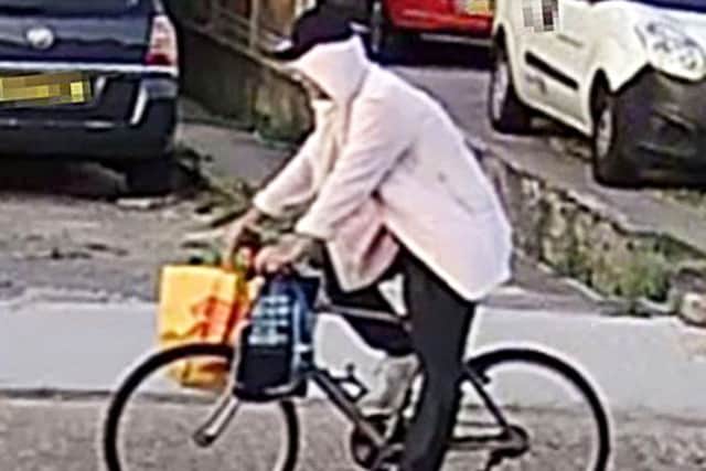 Undated CCTV grab issued by Kent Police of James Walker, a thief who made his getaway from a burglary on a pedal bike and wearing a light pink dressing gown (Photo: Kent Police/PA Wire)