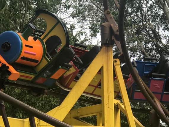 Emergency services used ladders, ropes and scaffolding to reach those stuck 50 feet in the air at Gulliver's World in Warrington during the two-hour rescue (Photo: PA Wire)