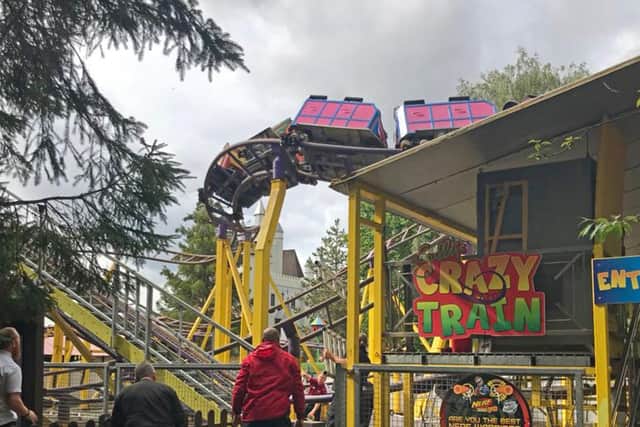 Emergency services used ladders, ropes and scaffolding to reach those stuck 50 feet in the air at Gulliver's World in Warrington during the two-hour rescue (Photo: PA Wire)