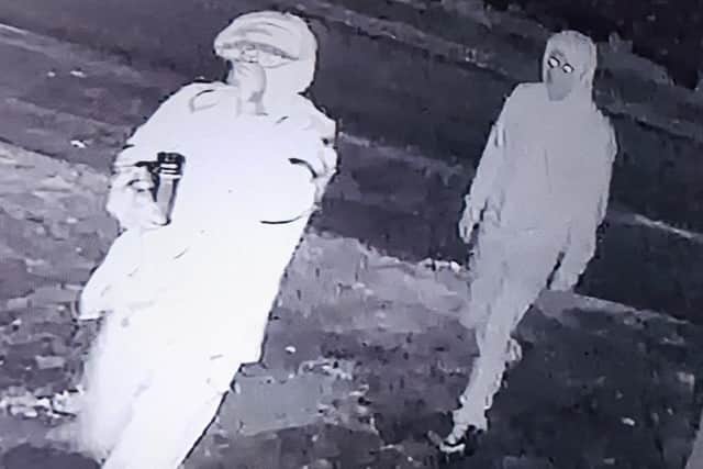 The two suspects approaching the front of Mr Patel's house in Lowthorpe Road