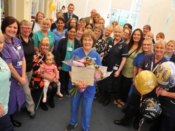 Janet Ashton celebrates her 80th birthday with a surprise party, organised by colleagues, family and friends, she has been a nurse since 1958 and still works at Royal Preston Hospital.