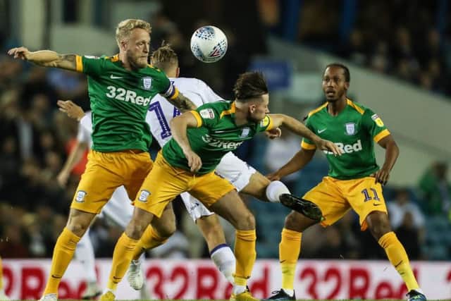 Alan Browne (centre) competes for the ball in Preston's defeat to Leeds at Elland Road