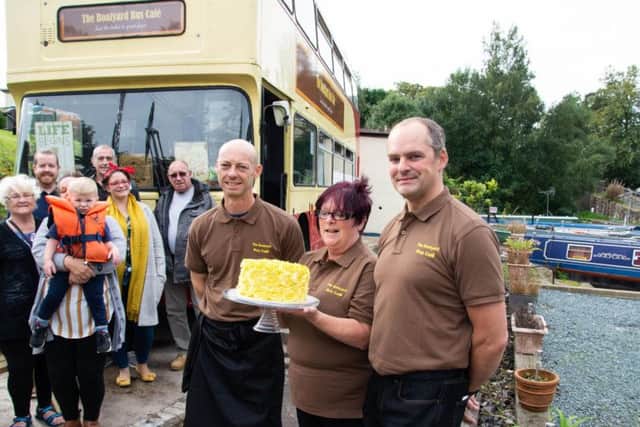 Co-owners Lucien Burkhardt (right) and Adam Pope with Denise Le Marinel at The Boatyard Bus Cafe which has opened on the Leeds and Liverpool canal in Chorley