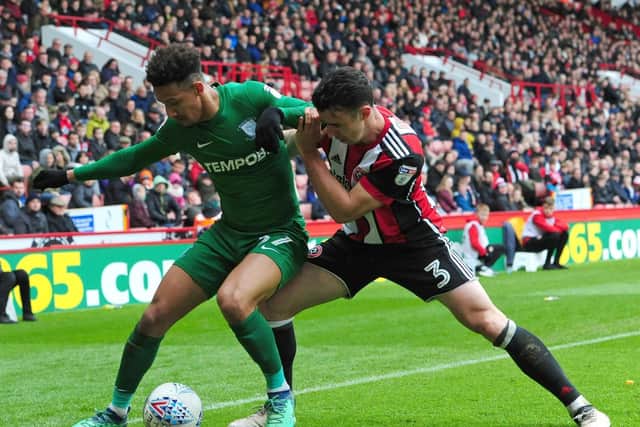 Callum Robinson under pressure from Enda Stevens during the last meeting between the sides.