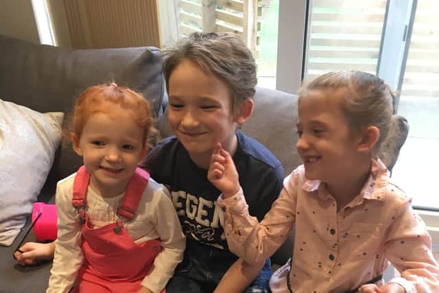 Jessica Woods, six, who has NF1, with her brother Harrison, eight, and sister Amaya, three