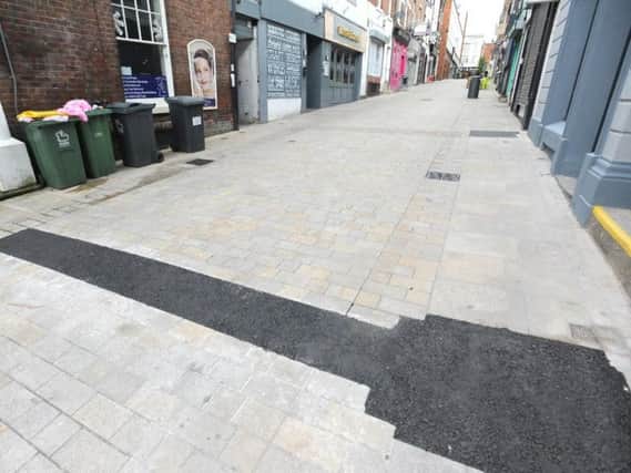 The unsightly asphalt on Cannon Street