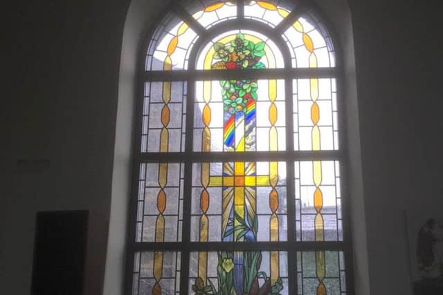 The new "Let There Be Light and Hope" window at St Peter and St Paul's church  in Ribchester