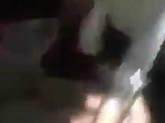 Footage shows a youth holding a knife