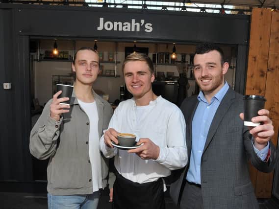 Adam Jonah Gardner, centre, has set up Jonah's coffee shop at Preston's new box market, transforming a shipping container to a sit-in and take away coffee shop, pictured with brother Luke Gardner, left, and friend Andy Mayer, right, who helped with the installation.