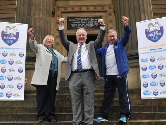 Former Preston Mayor and Mayoress of Preston, Coun Brian and Trisha Rollo, with Graham Jackson when he announced the Preston 10k is coming back
