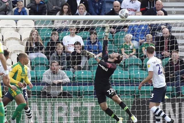 Chris Maxwell produces a sharp save to keep out Kyle Bartley's header