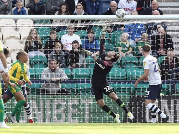 Chris Maxwell produces a sharp save to keep out Kyle Bartley's header