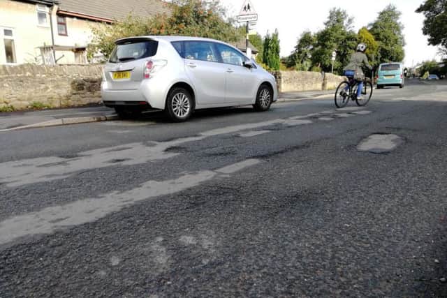 The road surface on Chorley Old Road, close to Little Quarry, which a council report says has deteriorated as a result of occasional surface water flooding.