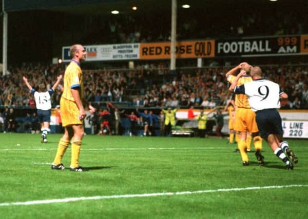 PNE midfielder Neil McDonald (No.13) turns to celebrate after making it 4-4 against Wigan in September 1996 and Andy Saville sets off to congratulate him