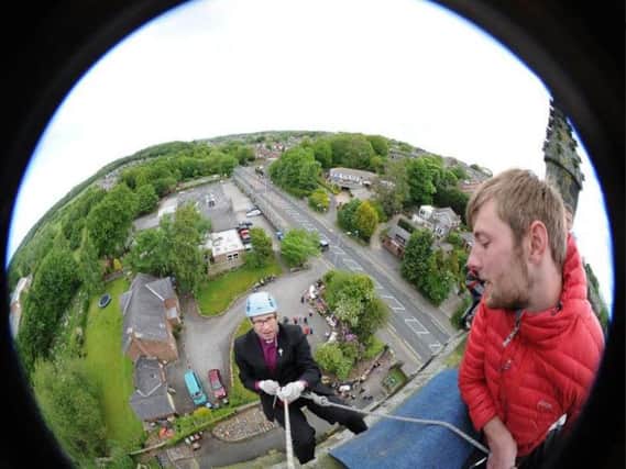 Bishop Philip North abseiled down the outside of St Johns Church tower in Whittle-le-Woods, near Chorley in 2015