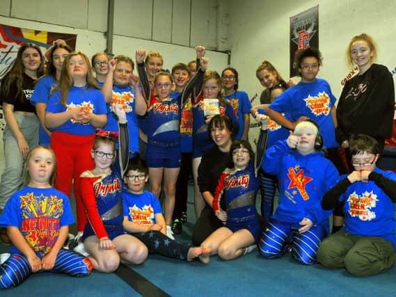 Sian Thorley, front centre, coach at Infinity Cheer, Whittle-Le-Woods, has won the Community Spirit Award for working with special educational needs group, Shooting Stars.