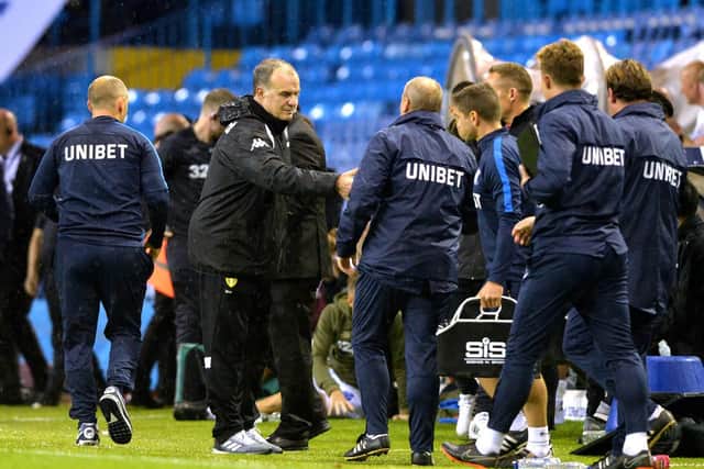 Bielsa with Preston's staff after Leeds' Championship win over North End