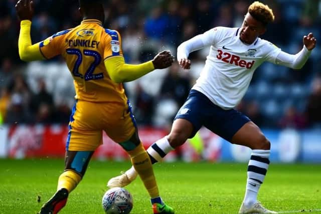 Callum Robinson battles with Chey Dunkley at Deepdale on Saturday