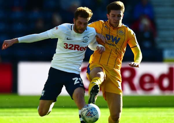 Preston North End's Tom Barkhuizen battles for the ball